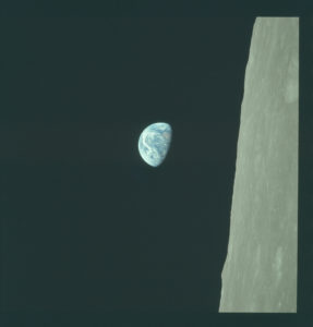 Earthrise. An image of Earth rising past the horizon of the moon. 